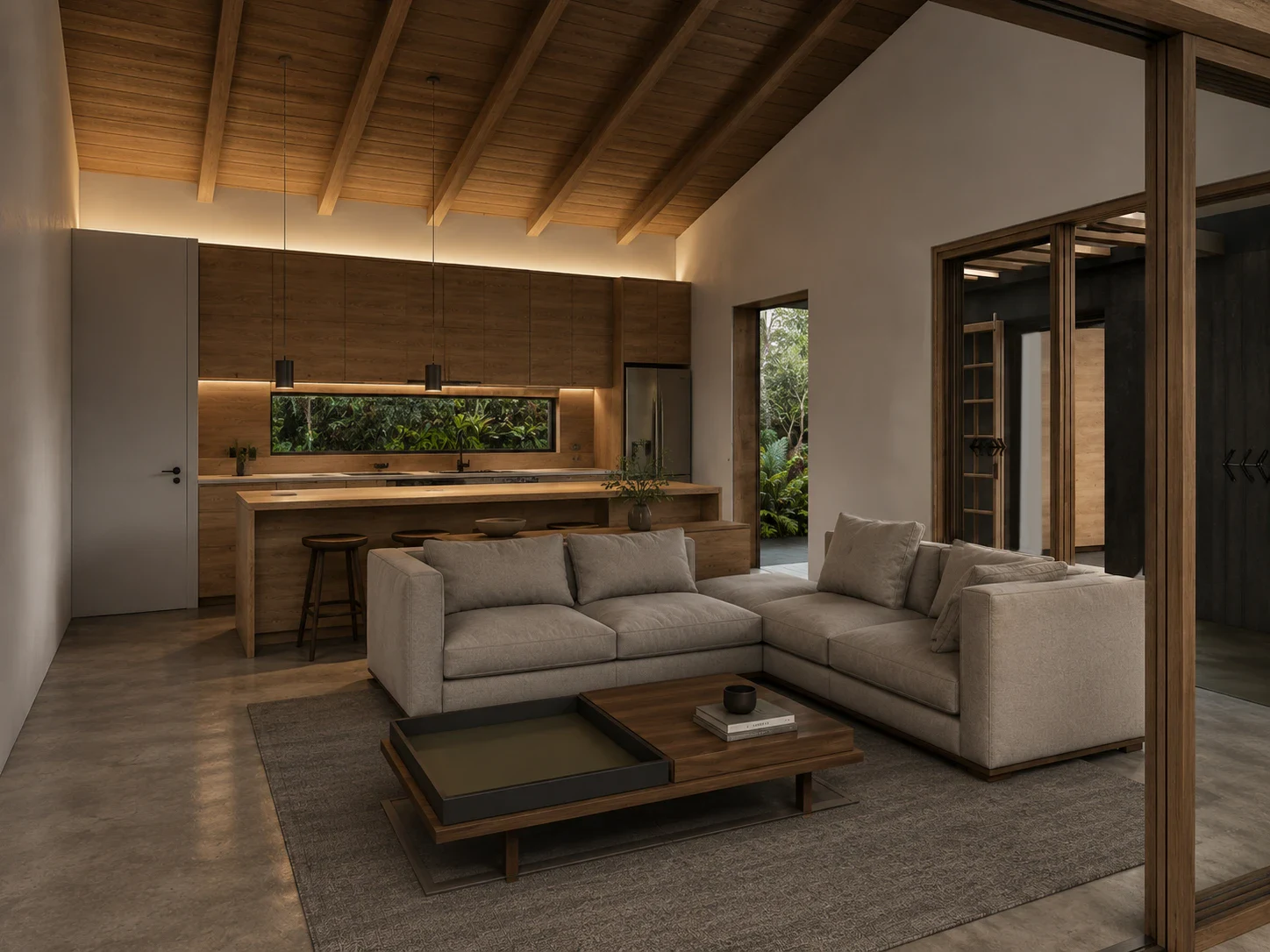 Zona social de ORO 01, vivienda unifamiliar en Orocovis, Puerto Rico: sala y cocina integradas bajo una cubierta de vigas de madera, con sofá en L, isla de madera y ventanales corredizos al jardín — LINEA PRIMA, arquitectos en Bogotá.