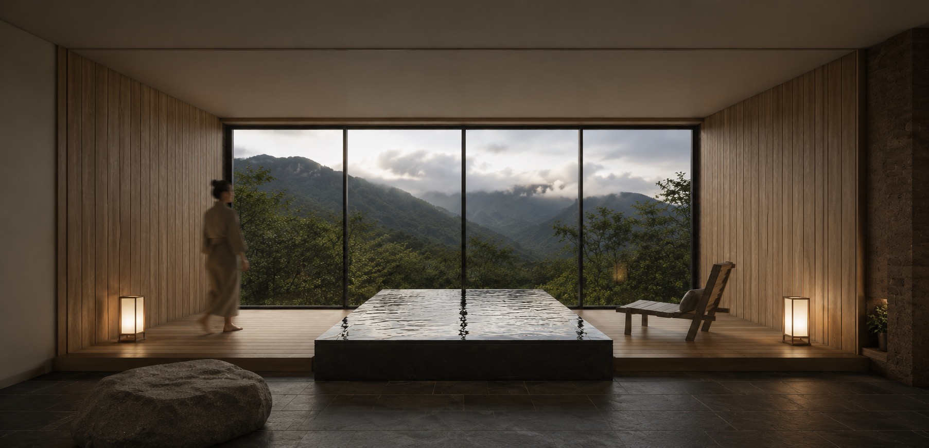 Sala de doble altura con ventanal hacia las montañas